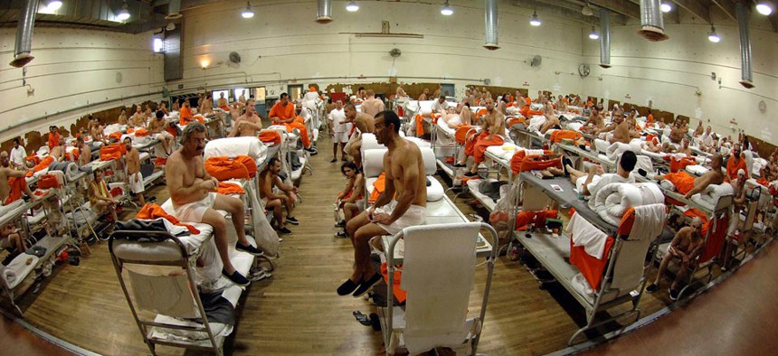 Inmates sit at the California Institute for Men in Chino