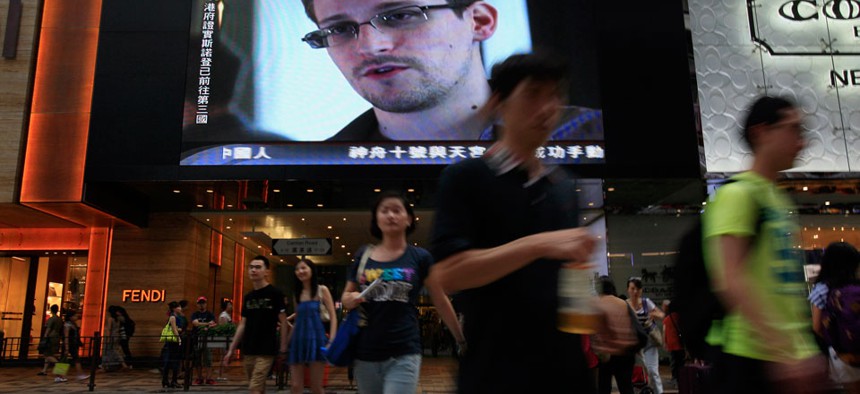 A Hong Kong mall TV screen shows a news report of Edward Snowden in June.