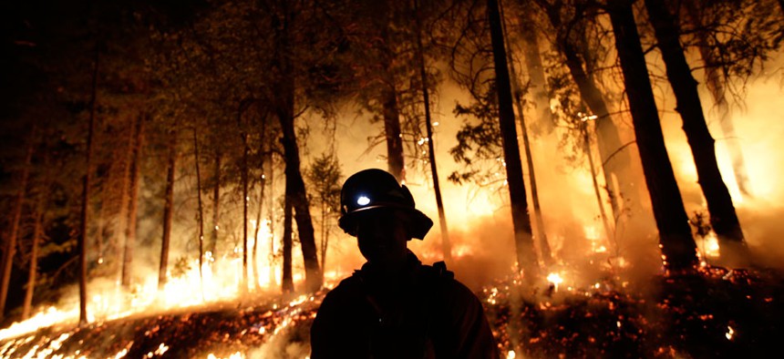 Firefighter helps battle the Rim Fire near Yosemite National Park, Calif.