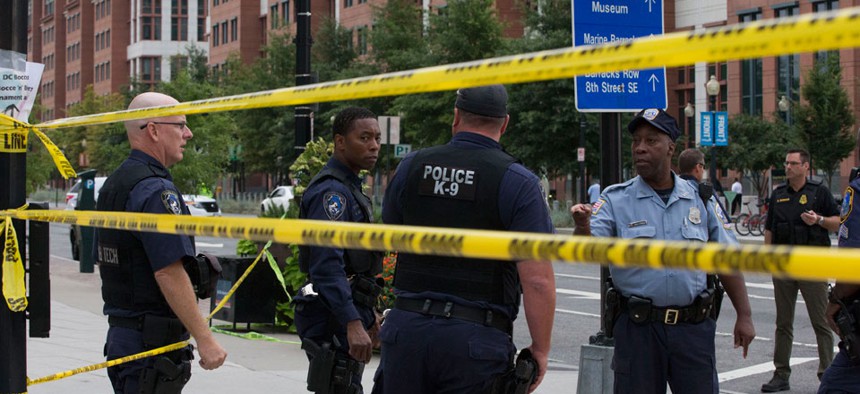 Police tape off a section of DC around the Navy Yard Monday.
