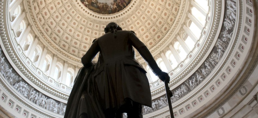 A statue of George Washington stands in the Rotunda of the U.S. Capitol Sunday morning, Sept. 29, 2013 as a government shutdown looms.