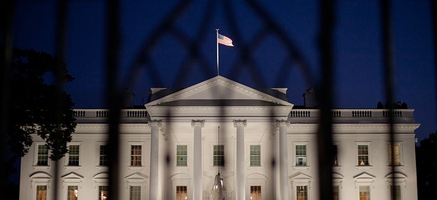 The White House in Washington is seen at night, Monday, Sept. 30, 2013. 