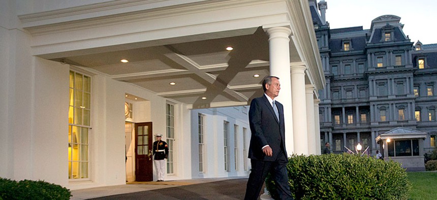 House Speaker John Boehner, R-Ohio, walks out of the West Wing of the White House after meeting with President Obama on Wednesday, Oct. 2, 2013.  