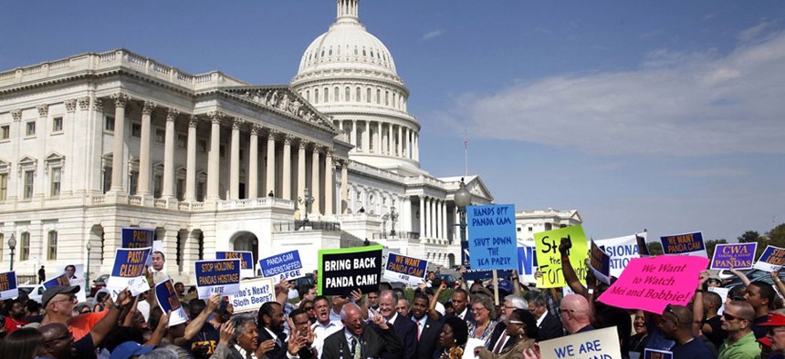 Protesters gathered at the Capitol Sunday to demonstrate against the shutdown.