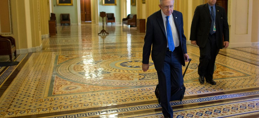 Harry Reid walks to his office Monday.