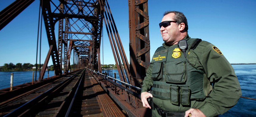 Senior Border Patrol Agent Sheldon Cooper monitors the International Railroad Bridge in Buffalo, N.Y.