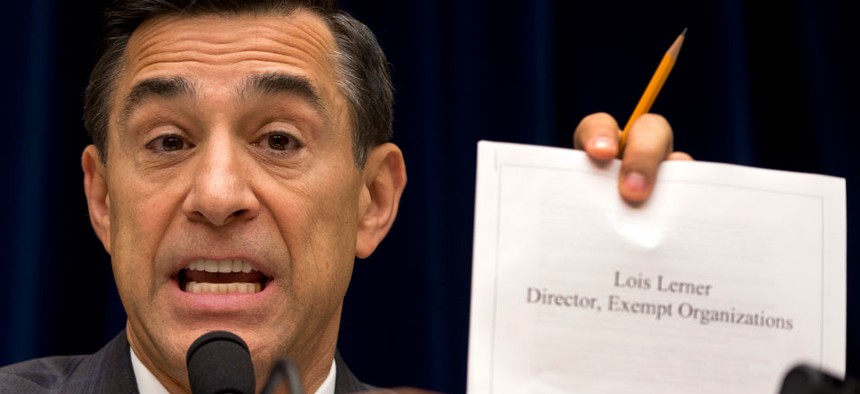 Rep. Darrell Issa, R-Calif.,  holds up documents during a hearing on the IRS in May.