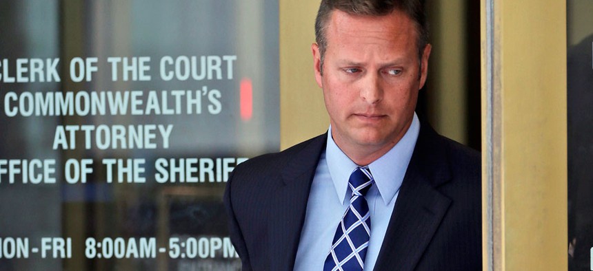Lt. Col. Jeffrey Krusinski, who led the Air Force's Sexual Assault Prevention and Response unit, is seen leaving the Arlington County General District Court, Thursday, July 18, 2013.