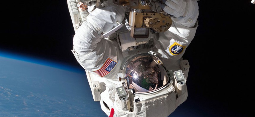 Astronaut Chris Cassidy performs a space walk on the International Space Station