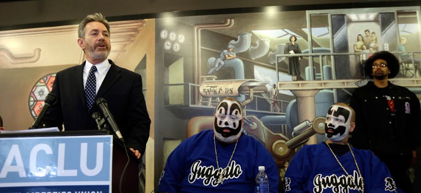 Michael J. Steinberg, legal director for the ACLU of Michigan addresses the media as members of the Insane Clown Posse listen in Detroit. 