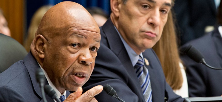 Rep. Elijah Cummings, D-Md., the ranking member of the House Oversight and Government Reform Committee, left, accompanied by the committee's Chairman Rep. Darrell Issa, R-Calif.