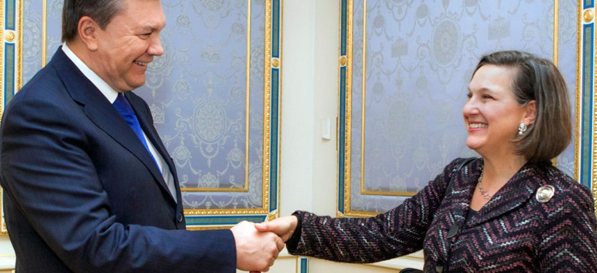 Ukraine's President Viktor Yanukovych, left, greets U.S. Assistant Secretary for European and Eurasian Affairs Victoria Nuland.
