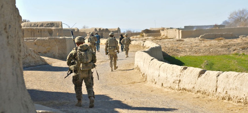 American soldiers conduct a partnership patrol with members of the Afghan Uniformed Police in Kandahar in December.