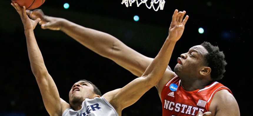 Xavier's Dee Davis shoots against North Carolina State's Beejay Anya in the first round of the NCAA tournament Tuesday.