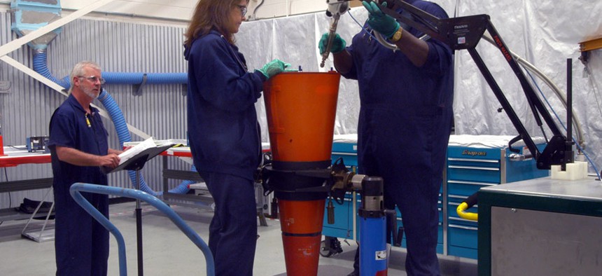 Technicians perform maintenance on W-76 nuclear warhead. 