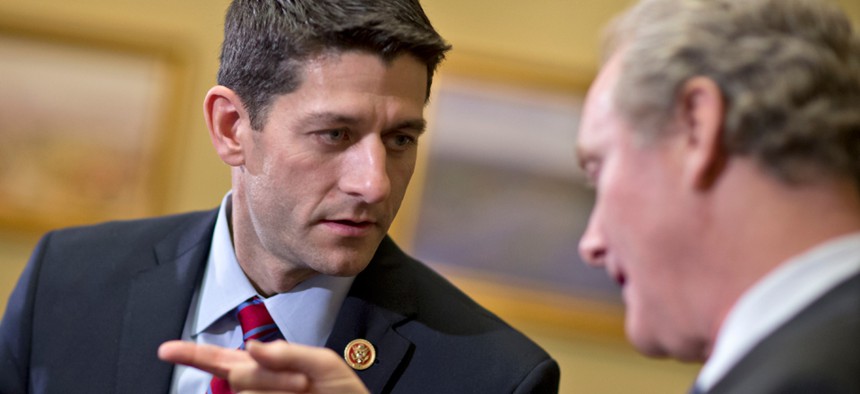 House Budget Committee Chairman Rep. Paul Ryan, R-Wis., left, speaks with Rep. Chris Van Hollen, D-Md., in December.