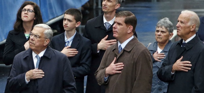 U.S. Vice President Joe Biden, Boston Mayor Marty Walsh, and former Boston Mayor Thomas Menino, stand along with the family of Boston Marathon bombing victim Martin Richard.