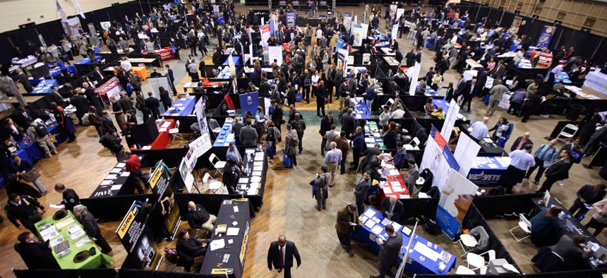 Veterans, military spouses, and transitioning service members meet with employers at the U.S. Chamber of Commerce Foundation's Hiring Our Heroes job fair on March 27, 2014 in New York. 