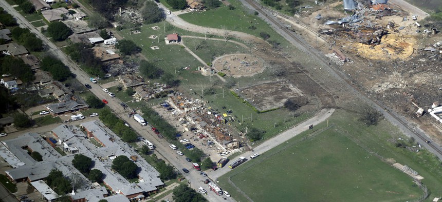 The remains of a nursing home, left, apartment complex, center, and fertilizer plant, right, destroyed by an explosion at a fertilizer plant in West, Texas.