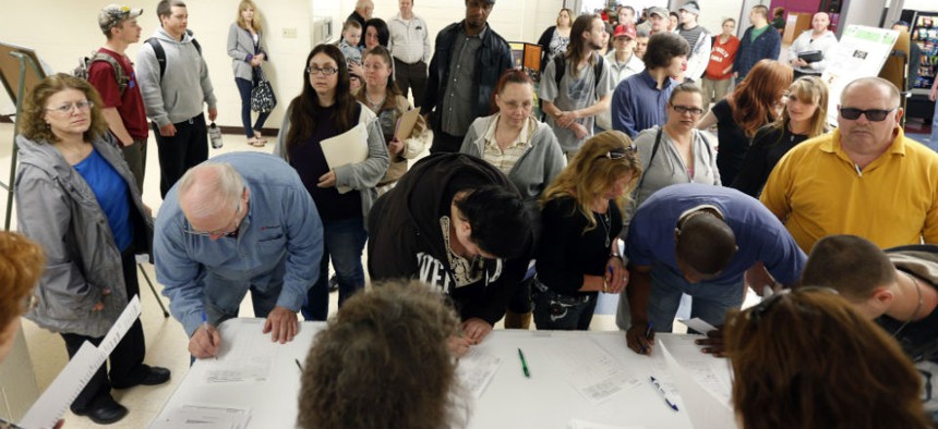 Job seekers line up for a job fair at Columbia-Greene Community College in Hudson, N.Y. 