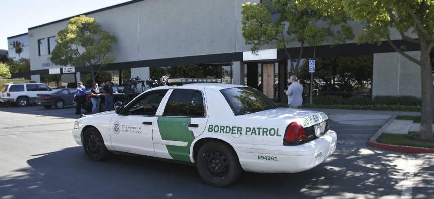 A Border Patrol vehicle drives in San Diego, CA