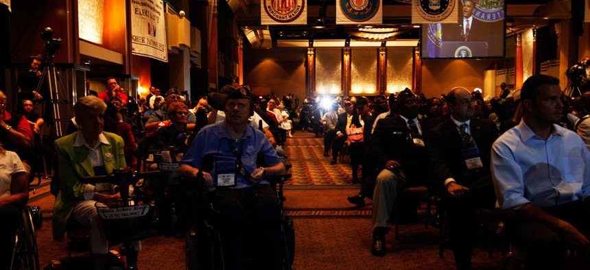 Audience members listen as President Barack Obama speaks about Iraq and Afghanistan at the Disabled American Veterans national convention in Atlanta in 2010.