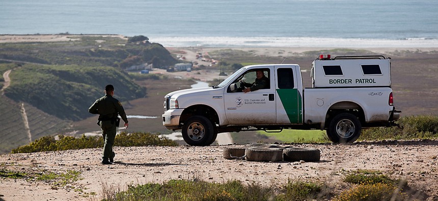 Border agents patrol a beach in 2012.