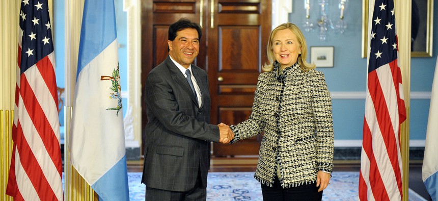 Happier times: Hillary Rodham Clinton shakes hands with Guatemalan Foreign Minister Harold Caballero as Secretary of State in 2012
