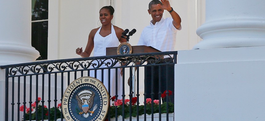 The Obamas greet military families as they host an Independence Day celebration Friday.