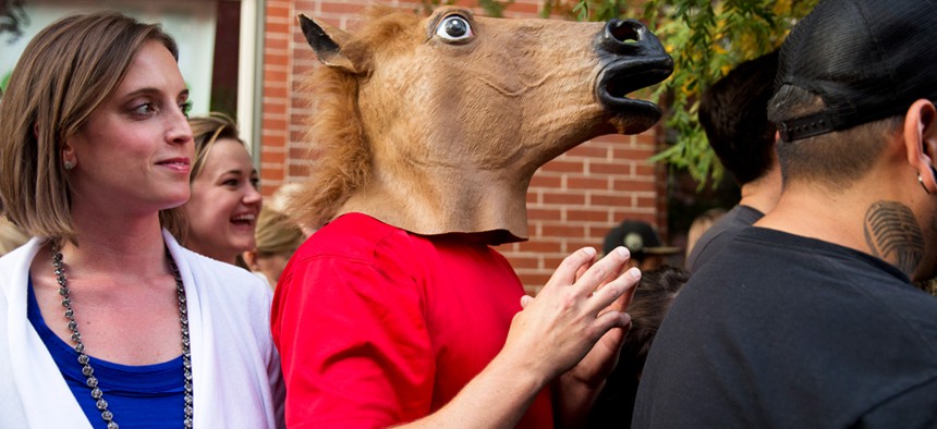 The man in the horse mask waited to meet Obama in Denver. 