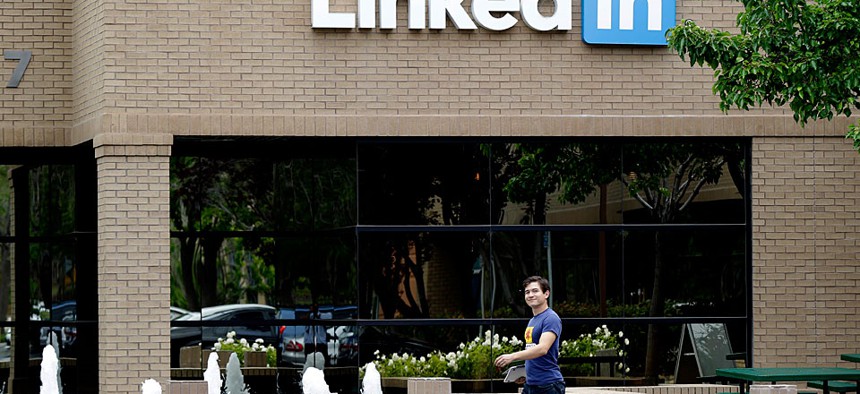 A man walks past the LinkedIn headquarters in Mountain View , Calif.
