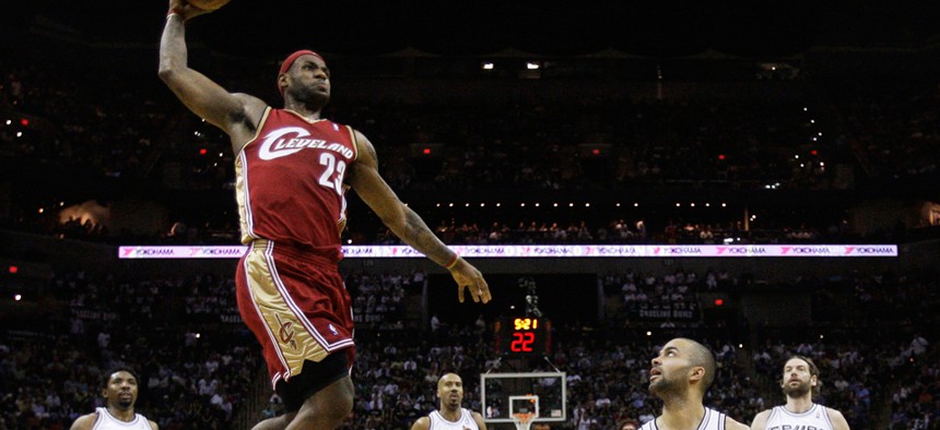 LeBron James attempts a dunk in 2009 against the Spurs in his original run with the Cleveland Cavaliers.