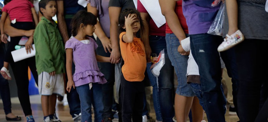 Immigrants who entered the U.S. illegally stand in line for tickets at the bus station after they were released from a U.S. Customs and Border Protection processing facility in McAllen, Texas.