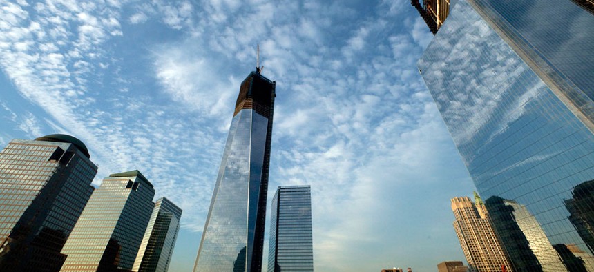 One World Trade Center, center, rises above the National September 11 Memorial and Museum at the World Trade Center in New York.