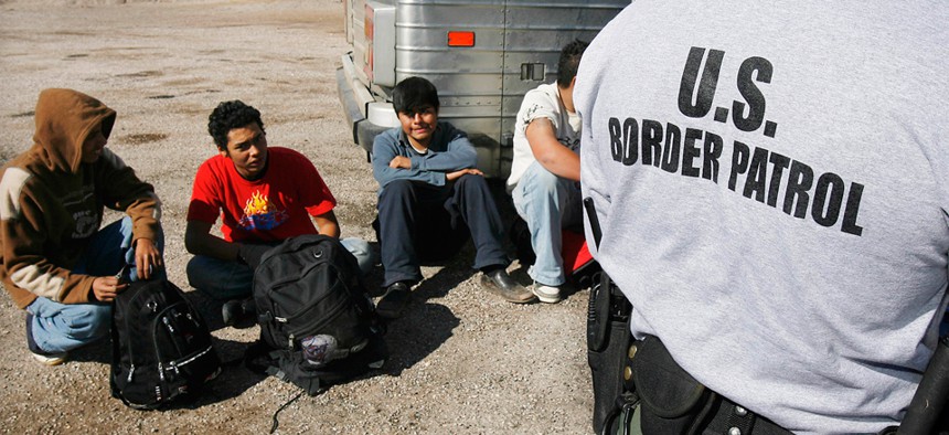 Immigrants are detained by the Arizona border in 2007.