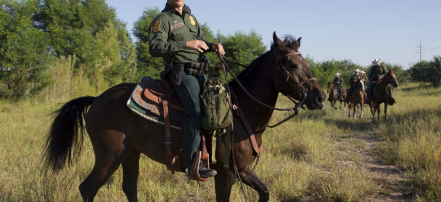 Border Patrol agents from the McAllen station horse patrol unit on patrol in South Texas.