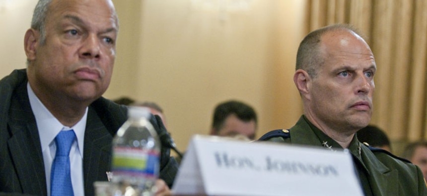 DHS Secretary Jeh Johnson (left) testifies in June with Border Patrol Deputy Chief Ronald Vitiello on the problem of unaccompanied minors crossing the border. 