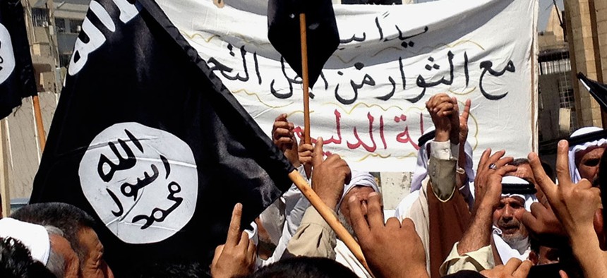 Demonstrators chant support for the Islamic State of Iraq and the Levant in Mosul in June.