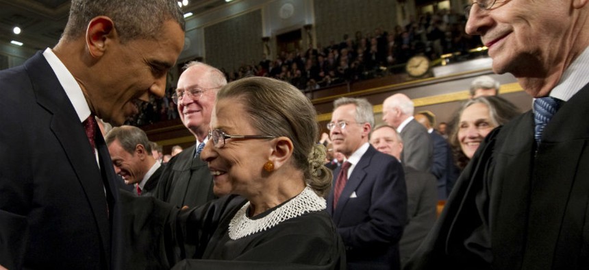 President Barack Obama greets Supreme Court Justice Ruth Bader Ginsburg prior to his State of the Union address in front of a joint session of Congress on Tuesday, Jan. 24, 2012.