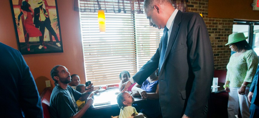 Attorney General Eric Holder visits Drake's Place restaurant for a meeting with community leaders on Aug. 20 in Ferguson.