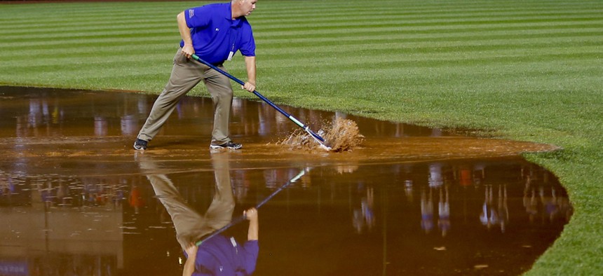 A member of the grounds crew works on the infield at Chicago's Wrigley Field on August 21