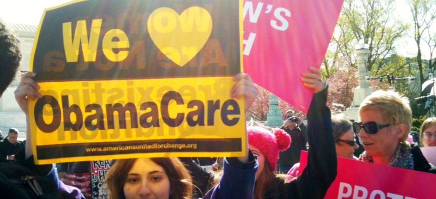Women rally in support of Obamacare in front of the Supreme Court in 2012. 