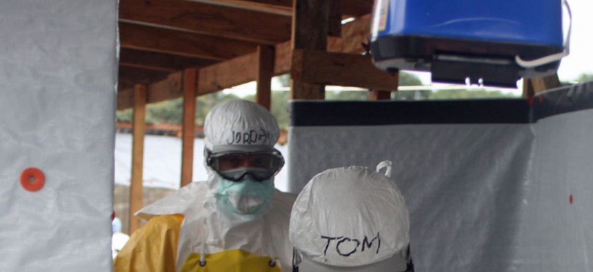 Dr. Tom Frieden, Director of the U.S. Centers for Disease Control and Prevention, is decontaminated last week after visiting aid workers in Africa.