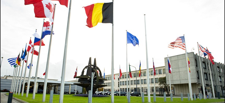 Member flags fly outside NATO's Brussels headquarters.