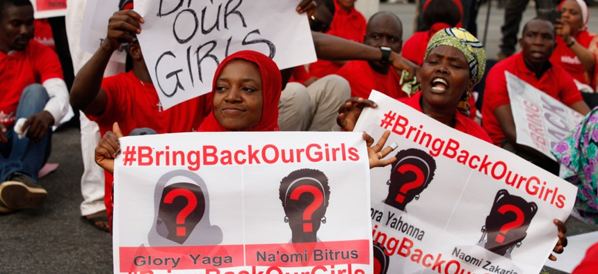 Demonstrators rally in support of girls kidnapped by Boko Haram in May in  Abuja, Nigeria.