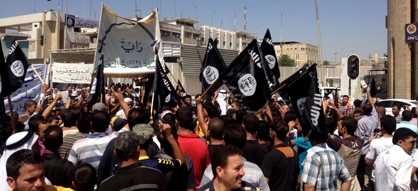 Supporters of the Islamic State rally in Mosul in June.