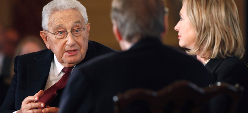Henry Kissinger and Hillary Clinton speak during an interview with Charlie Rose in 2011.