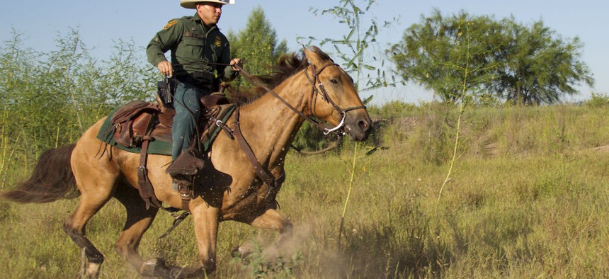 An agent patrols on horseback in South Texas. 