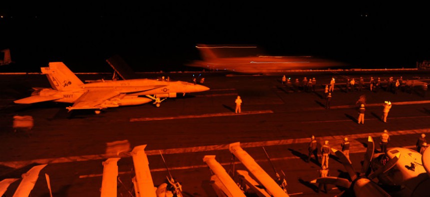 F/A-18 aircraft prepare to launch from the flight deck of the aircraft carrier USS George H.W. Bush to conduct strikes against ISIL on Sept. 22.