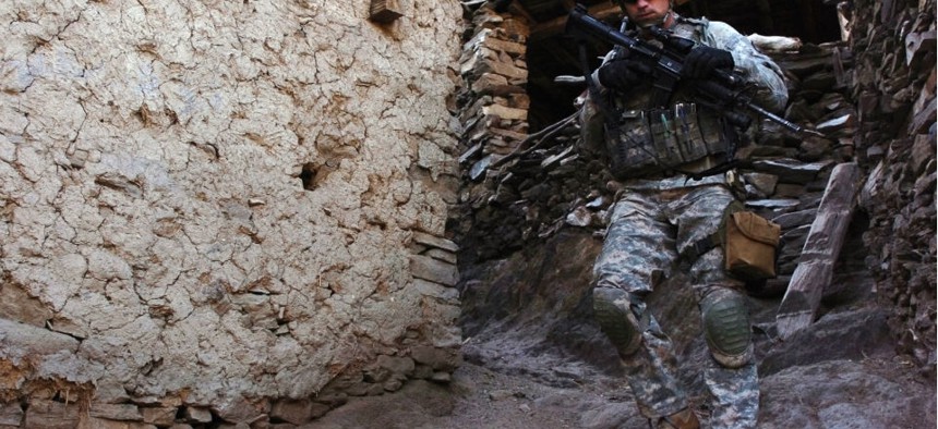 U.S. Army Pfc. Perry Price patrols the village of Aliabad in Kunar province, Afghanistan. 